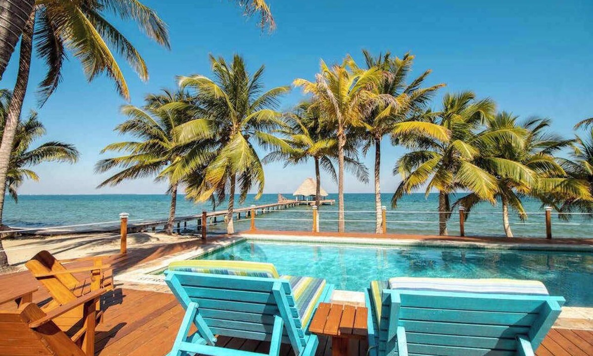 Placencia Condo | Beachfront, ocean-view getaway with shared pool, hammock, WiFi, & central AC