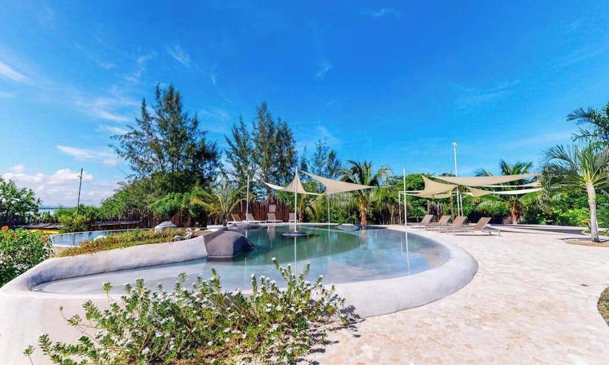 Cocoplum Villa | Lagoon view retreat villa with pool, private hot tub, & AC