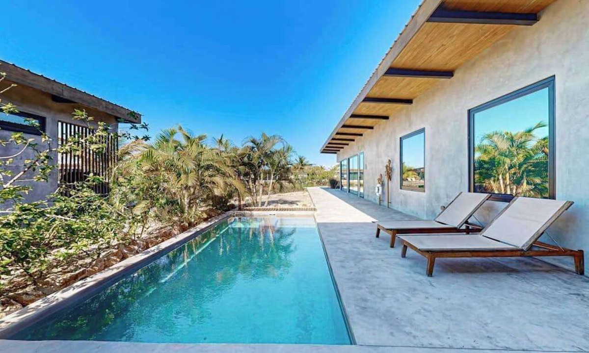 Placencia Villa | Luxury villa in gated community with tropical garden, pool & pet friendly