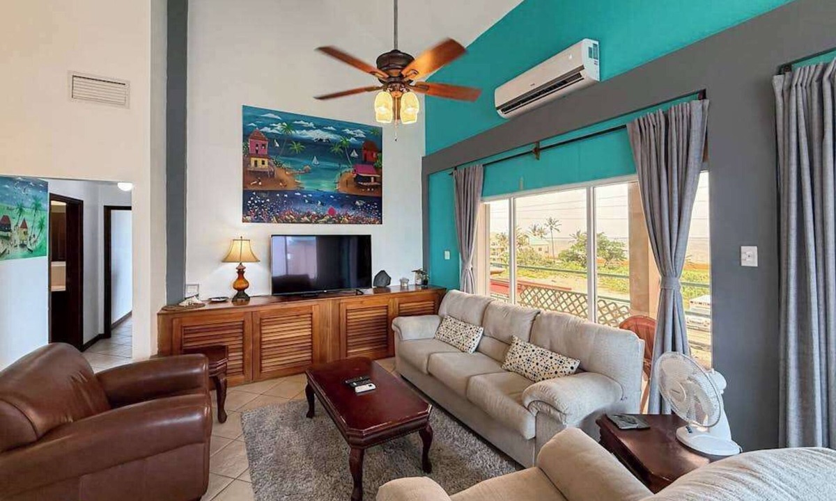 San Pedro Condo | Ocean-view home with balcony, swimming pool & central AC