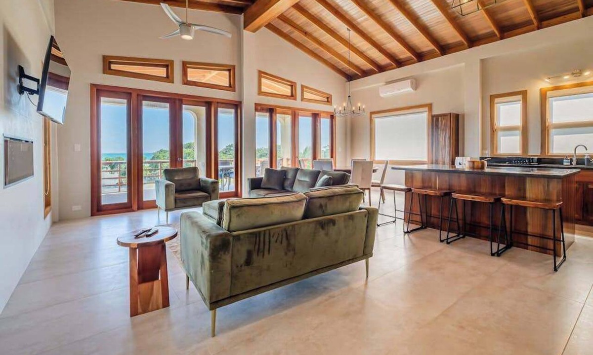 Caye Caulker Villa | Tropical retreat villa with a pool, dock, bikes, canoes, balconies, and 360 views