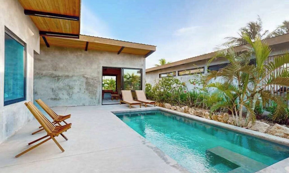 Placencia Villa | Waterfront villa with pool, spacious deck, dog-friendly & office space