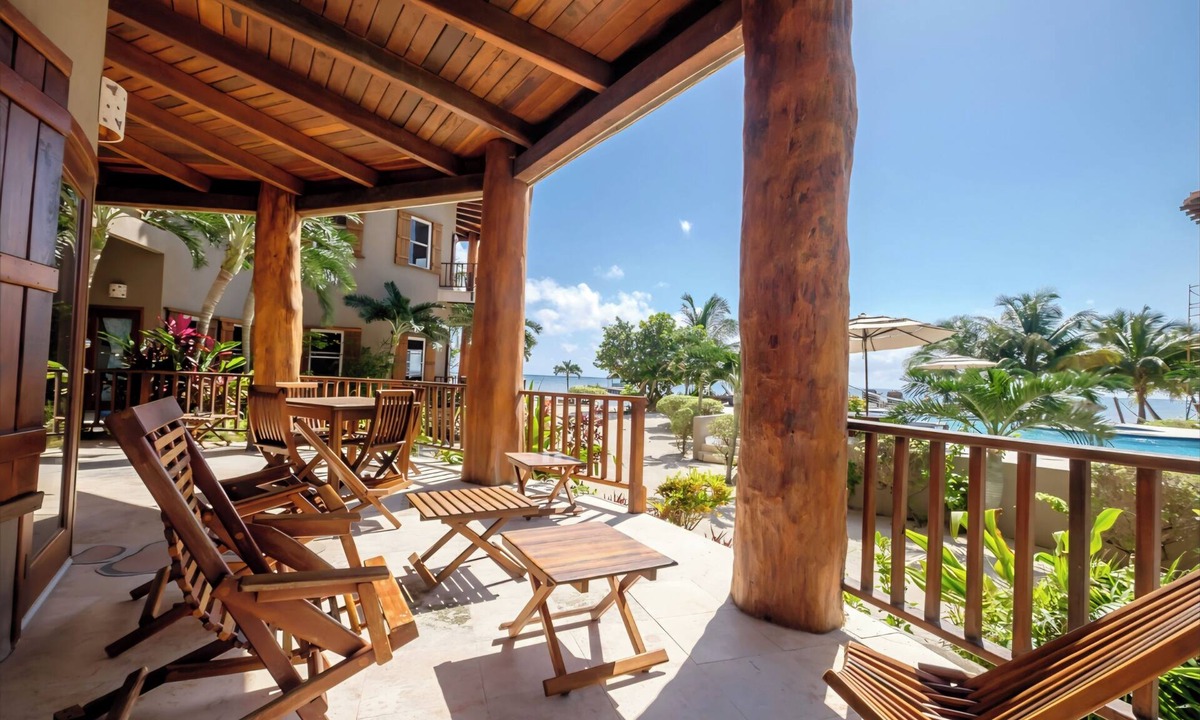 Gales Point Condo | Welcome in the island breeze or head outside to sit on the large deck,