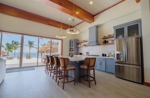 San Pedro House | 4BR NEW Oceanfront Luxury, Steps Into the Caribbean, Private Pier & Rooftop