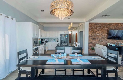 Boca Ciega Apartment | Amazing 2 story oceanfront house with pool, balcony, central AC, & WD