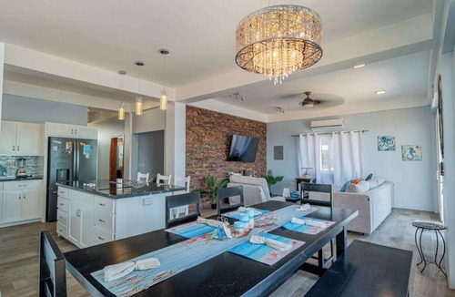 Boca Ciega Apartment | Amazing 2 story oceanfront house with pool, balcony, central AC, & WD