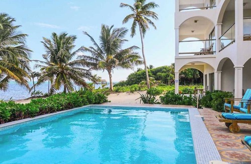 San Pedro Condo | Beachfront condo with ocean views, WiFi, partial AC & shared pool/dock/kayaks