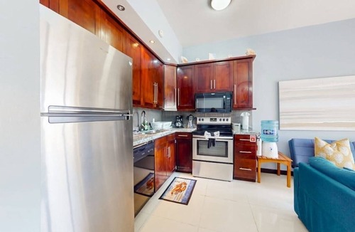 San Pedro Condo | Beachfront condo with balcony, sea view, partial AC, pool, dock & kayaks