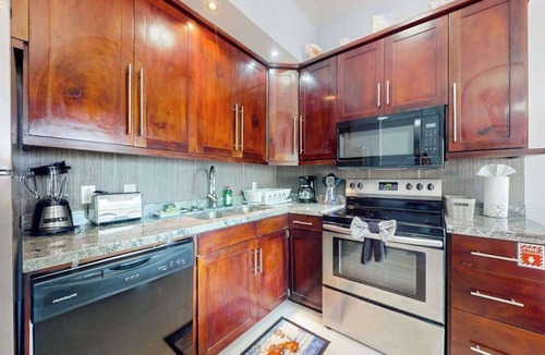 San Pedro Condo | Beachfront condo with balcony, sea view, partial AC, pool, dock & kayaks
