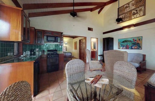 Placencia Condo | Beachfront, ocean-view getaway with shared pool, hammock, WiFi, & central AC