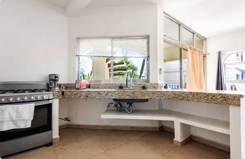 Centro Apartment | Casa Blanca: 4-unit building with rooftop lounge, minutes from 5 Avenida