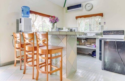 San Ignacio House | Charming Home w Central AC, Shared Pool, & Garden- Day Trip Opportunities