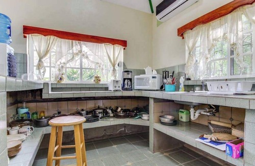 San Ignacio House | Charming Home w Central AC, Shared Pool, & Garden- Day Trip Opportunities