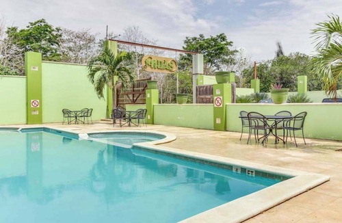 San Ignacio House | Charming Home w Central AC, Shared Pool, & Garden- Day Trip Opportunities