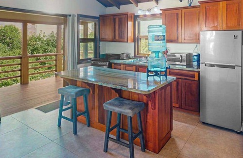 Caye Caulker House | Dazzling beach stay with a balcony - pool, bikes, canoes, grill, & dock access