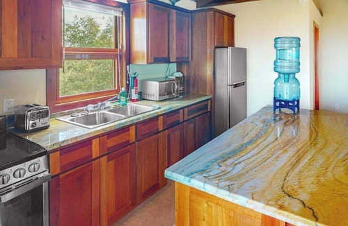 Caye Caulker House | Dazzling beach stay with a balcony - pool, bikes, canoes, grill, & dock access