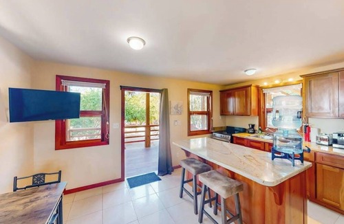 Caye Caulker House | Dazzling beach stay with a balcony - pool, bikes, canoes, grill, & dock access