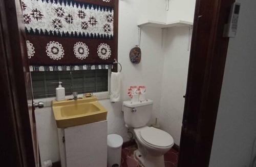 San Ignacio Apartment | Experience comfort and relaxation in our air-conditioned apartment, featuring two spacious bedrooms, a welcoming living room, a fully equipped private kitchen, and a well-appointed private bathroom. Perfect for families or groups.