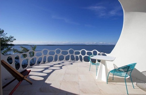 Cocoplum Apartment | Lagoon-front studio with water access, infinity pool, & AC