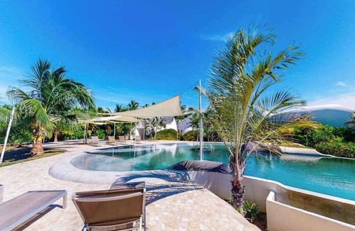 Cocoplum Condo | Lagoon View luxury suite with AC & pool