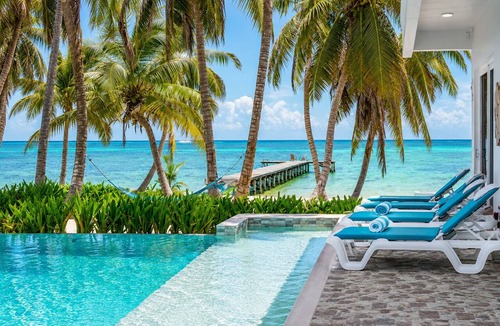 San Pedro House | Luxury beachfront vacation rental on Ambergris Caye with a private pool, rooftop lounge, private casita, direct beach access, and full-service concierge. Perfect for families, couples, and group getaways in Belize.
