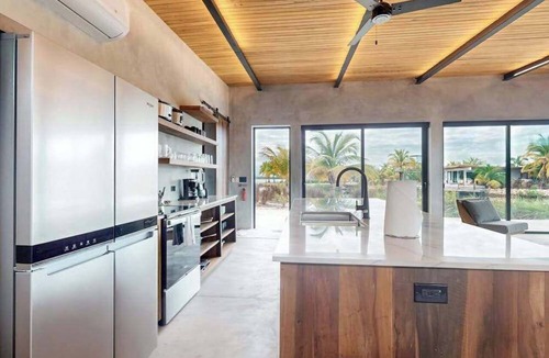 Placencia Villa | Luxury villa in gated community with tropical garden, pool & pet friendly