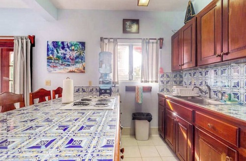 San Pedro Condo | Ocean-view apartment in a beachfront resort with shared pool, WiFi & partial AC