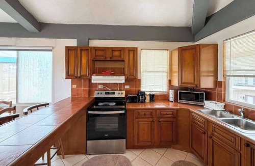 San Pedro Condo | Ocean-view home with balcony, swimming pool & central AC