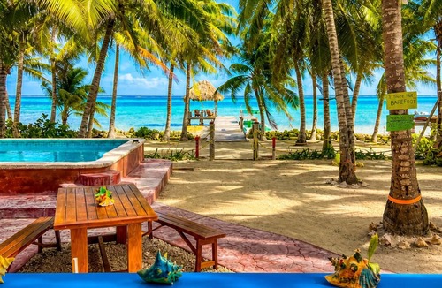 San Pedro Condo | Oceanfront 2BR/2BA Condo with Huge Pool, Private Dock, Beach & Reef Views