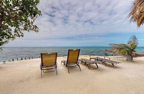 Sittee Point Apartment | Overwater cabin with oceanfront deck, island kitchen & sea breeze views