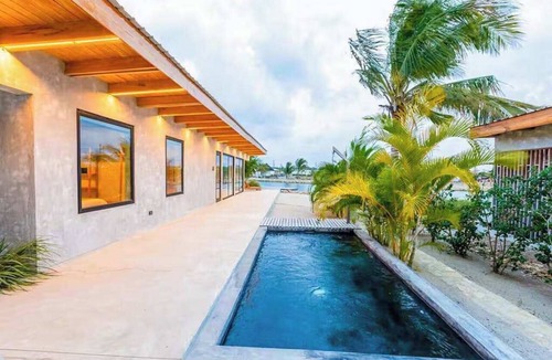 Placencia Villa | Relaxing tropical villa with private plunge pool, open layout & canal water view