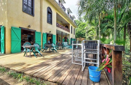 Bullet Tree Falls Apartment | Riverfront Retreat with Balcony, WiFi, Partial AC, Shared Pool