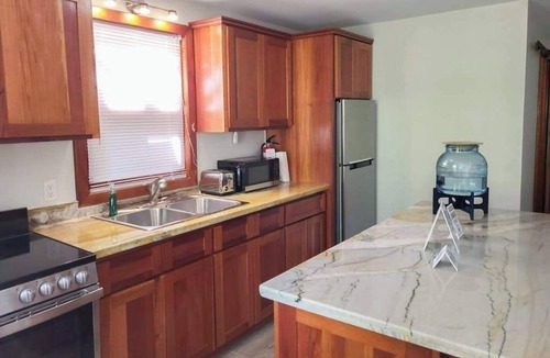 Caye Caulker House | Scenic retreat on the beach with a balcony - pool, grill, dock, and canoe access