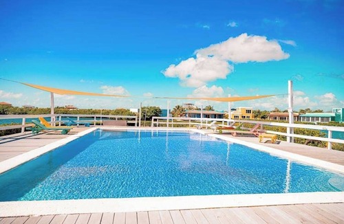 San Pedro Condo | Sea-view, dog-friendly condo with pool & central AC- between the beach & lagoon