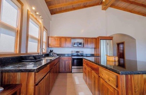 Caye Caulker Apartment | Spacious beachfront retreat with a soaking tub - pool, canoes, dock, & grill