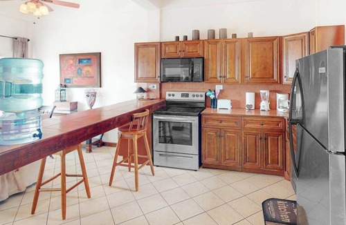 San Pedro Condo | Stylish condo near the beach with pool, fast WiFi, partial ocean views & AC