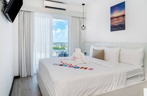 San Pedro Hotel | Sunset Unit 515 Lagoon-View | Balcony | Watermark