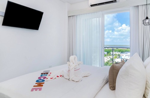 San Pedro Hotel | Sunset Unit 515 Lagoon-View | Balcony | Watermark