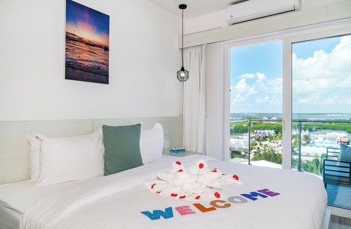 San Pedro Hotel | Sunset Unit 516 Lagoon-View | Balcony | Watermark