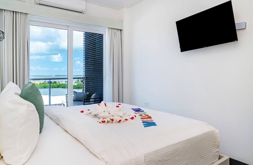 San Pedro Hotel | Sunset Unit 516 Lagoon-View | Balcony | Watermark