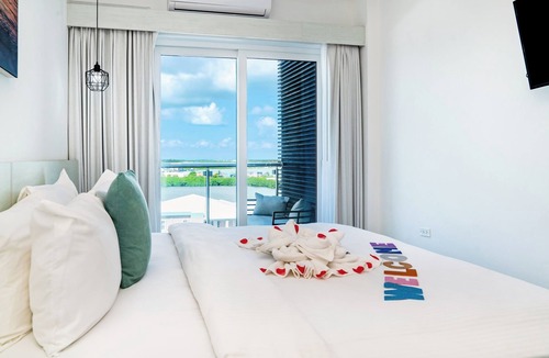 San Pedro Hotel | Sunset Unit 516 Lagoon-View | Balcony | Watermark