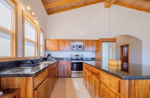 Caye Caulker Villa | Tropical retreat villa with a pool, dock, bikes, canoes, balconies, and 360 views