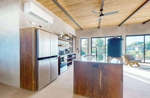 Placencia Villa | Waterfront villa with private pool, furnished deck & gas grill
