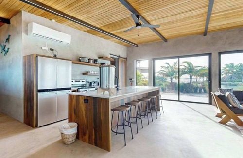 Placencia Villa | Waterfront villa with pool, spacious deck, dog-friendly & office space