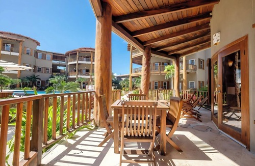 Gales Point Condo | Welcome in the island breeze or head outside to sit on the large deck,