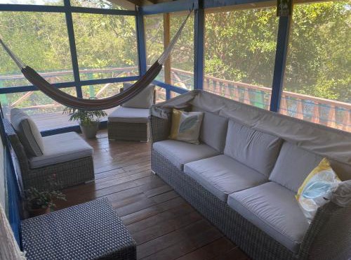 Amazing Jungle Tree House right over the river with bikes and canoe