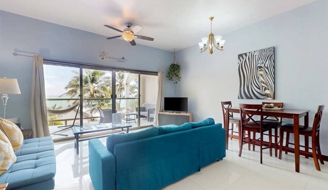 Beachfront condo with balcony, sea view, partial AC, pool, dock & kayaks