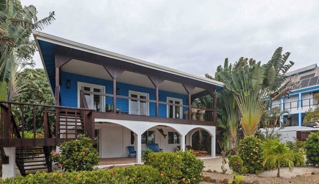 Beachfront home with dock, deck, hammocks, strong WiFi, AC & sea view