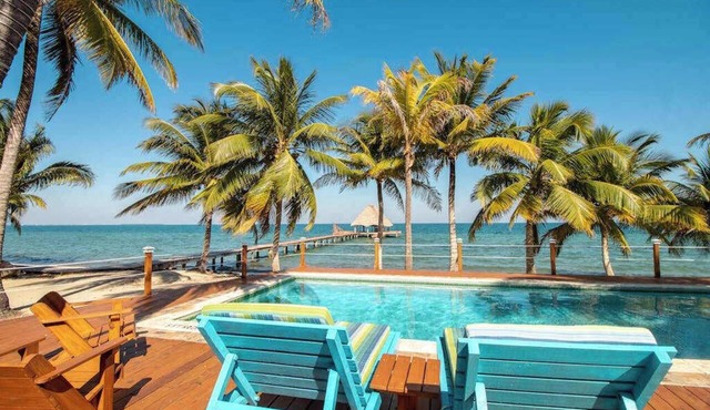 Beachfront, ocean-view getaway with shared pool, hammock, WiFi, & central AC