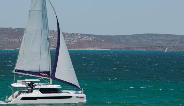 Caribbean Bliss: Sun-soaked Sailing Adventure from Placencia, Belize
